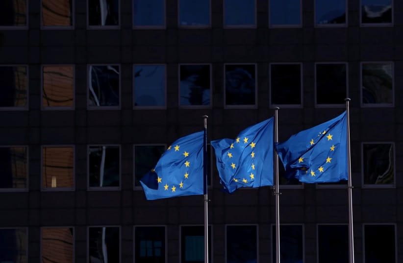European Union flags fly outside the European Commission headquarters in Brussels (credit: YVES HERMAN/REUTERS)