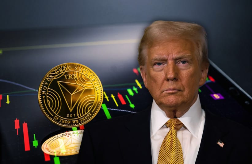   US president-elect Donald Trump seen with a Tron crypto coin (illustrative) (credit: REUTERS/SARAH MEYSSONNIER, SHUTTERSTOCK)
