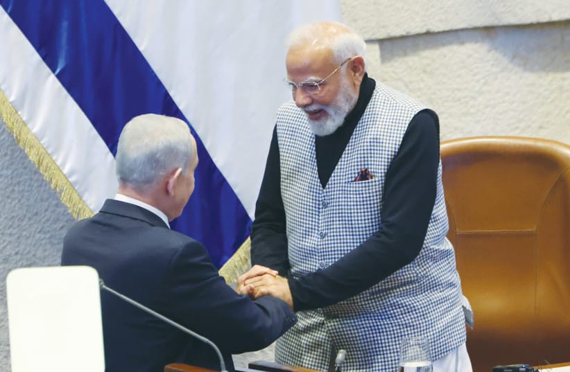 A VISIBLE EXPRESSION of friendship. Prime Minister Benjamin Netanyahu greets Indian Prime Minister Narendra Modi at the Knesset on Wednesday, marking Modi&rsquo;s first visit to Israel in nearly a decade. (credit: MARC ISRAEL SELLEM/THE JERUSALEM POST)