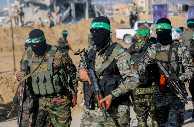 Hamas terrorists gather during a public event in Khan Younis, Gaza, on February 1, 2025. (credit: MOIZ SALHI/Middle East Images/AFP via Getty Images) Hamas terrorists gather during a public event in Khan Younis, Gaza, on February 1, 2025. (credit: MOIZ SALHI/Middle East Images/AFP via Getty Images)