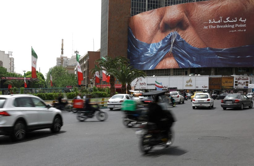 People drive past an anti-US billboard depicting U.S. President Donald Trump and the Strait of Hormuz, in Tehran, Iran, May 4, 2026. (credit: MAJID ASGARIPOUR/WANA/REUTERS) People drive past an anti-US billboard depicting U.S. President Donald Trump and the Strait of Hormuz, in Tehran, Iran, May 4, 2026. (credit: MAJID ASGARIPOUR/WANA/REUTERS)