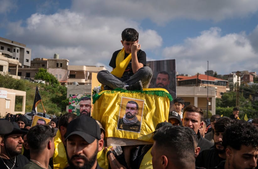 The son of a slain Hezbollah fighter sits on his coffin as it is carried during a funeral ceremony last month in Lebanon. After more than two years of war with Israel, analysts believe that Hezbollah now lacks power and legitimacy. (credit: Adri Salido/Getty Images) The son of a slain Hezbollah fighter sits on his coffin as it is carried during a funeral ceremony last month in Lebanon. After more than two years of war with Israel, analysts believe that Hezbollah now lacks power and legitimacy. (credit: Adri Salido/Getty Images)