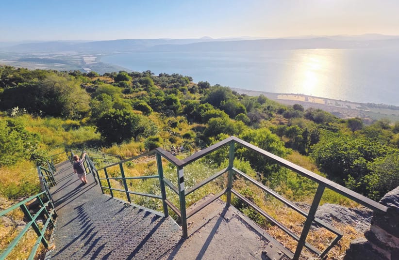 The Descent: A staircase winds downward from the resort complex, leading directly into the unscripted terrain of the plateau as sunset colors gather over the lake. (credit: NOAM BEDEIN)