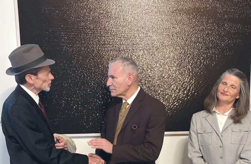 Heisenberg, played by David Golinkin (L), is greeted by Niels Bohr, played by Yehoshua Looks, with Bohr&rsquo;s wife, Margarethe, played by Miriam Metzinger. (credit: Ben Bard Players)