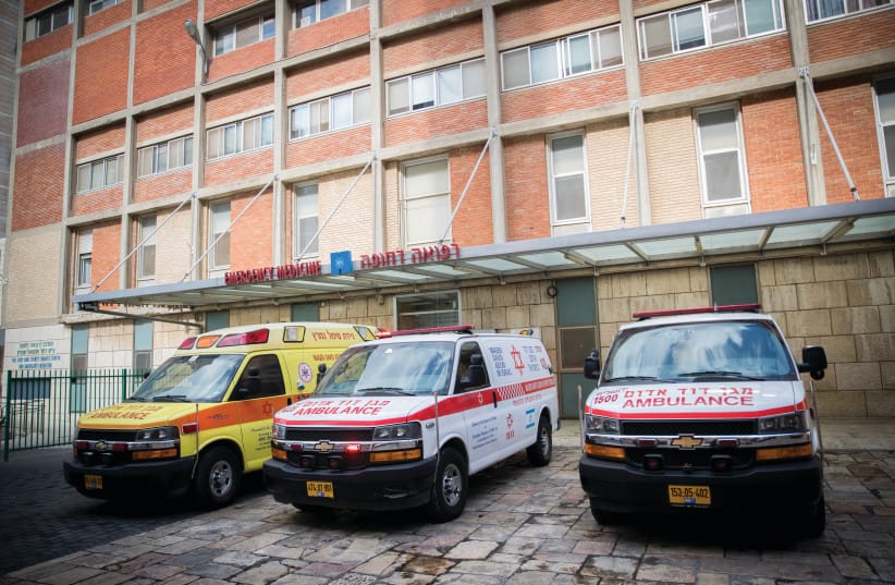  AMBULANCES ARE parked at the Hadassah Ein Kerem Hospital emergency room. (credit: YONATAN SINDEL/FLASH90)