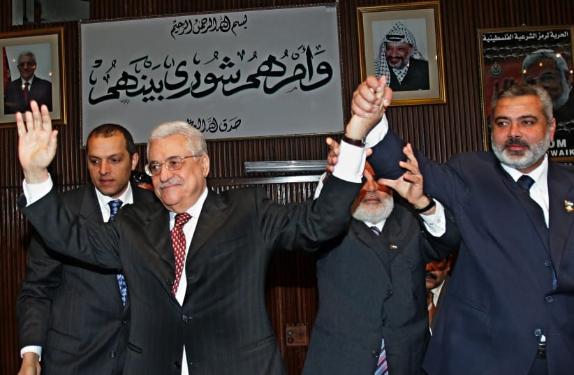 Palestinian Authority President Mahmoud Abbas and Hamas leader Ismail Haniyeh pictured in Gaza, March 17, 2007. (credit: Abid Katib/Getty Images) Palestinian Authority President Mahmoud Abbas and Hamas leader Ismail Haniyeh pictured in Gaza, March 17, 2007. (credit: Abid Katib/Getty Images)