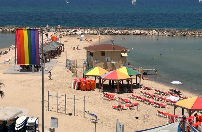 Tel Aviv's beaches decorated with pride flags ahead of the annual Tel Aviv Pride Parade. (credit: AVSHALOM SASSONI)
