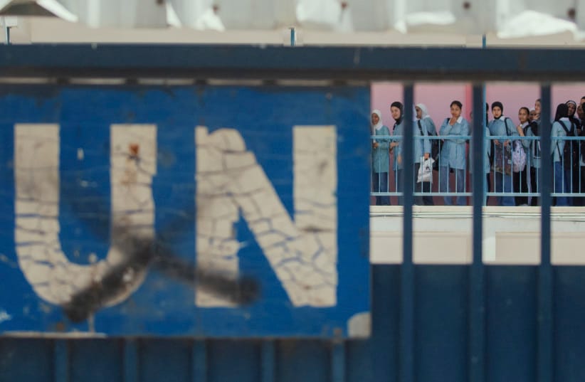A ''UN'' sign is seen on a gate as students gather behind it in a UNRWA school during a military raid in Nablus, West Bank, on May 20, 2025. (credit: WAHAJ BANI MOUFLEH/Middle East Images/AFP via Getty Images) A ''UN'' sign is seen on a gate as students gather behind it in a UNRWA school during a military raid in Nablus, West Bank, on May 20, 2025. (credit: WAHAJ BANI MOUFLEH/Middle East Images/AFP via Getty Images)