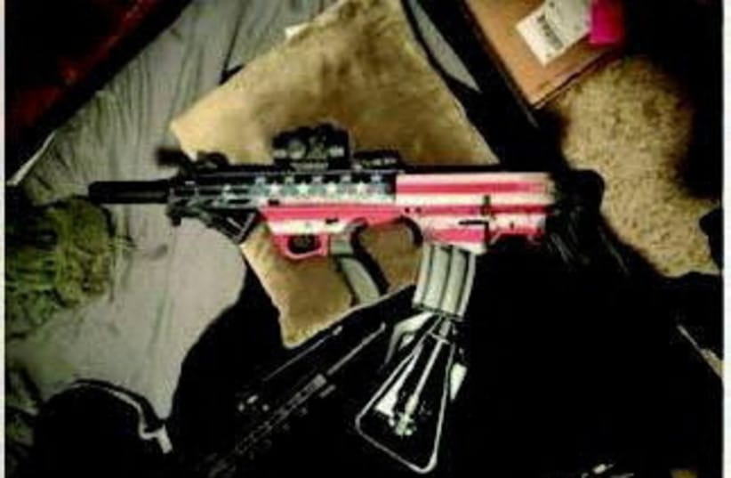 A photo of a suspect's gun is seen after the FBI said it thwarted a potential attack on the Ultimate Fighting Championship mixed martial arts event on the White House lawn on the weekend, in this handout image provided by the US Department of Justice in Washington. (credit: REUTERS/US DEPARTMENT OF JUSTICE/HANDOUT)