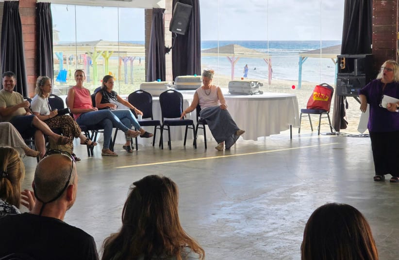 INSIDE THE RESORT&rsquo;S panoramic, glass-walled pavilion right on the beach, the clinicians participate in a lighter, connecting workshop designed specifically to cultivate shared laughter, release tension, and break their exhausting routine without the heavy burden of casework. (credit: NOAM BEDEIN)