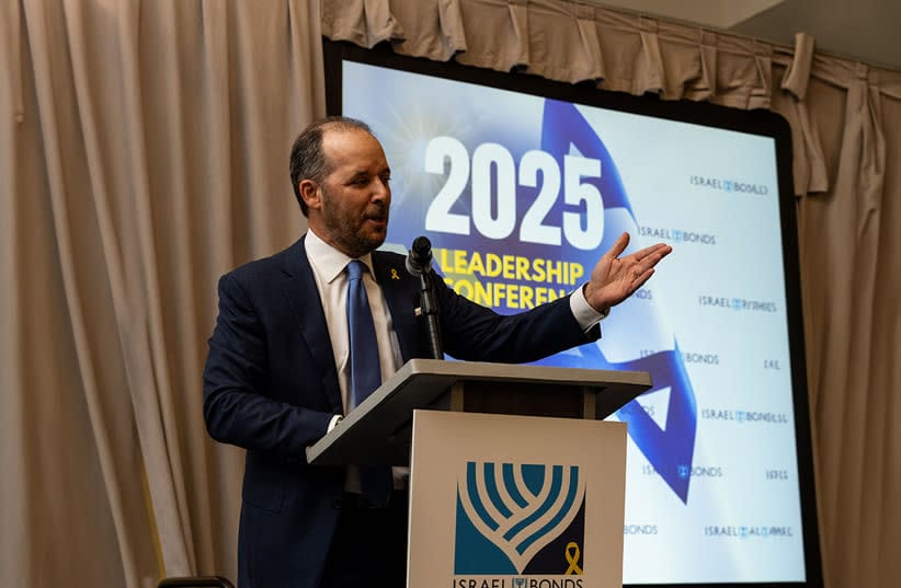 Larry Olschwanger speaks at the 2025 Israel Bonds Leadership Conference in Dallas.  (credit: SHAHAR AZRAN)