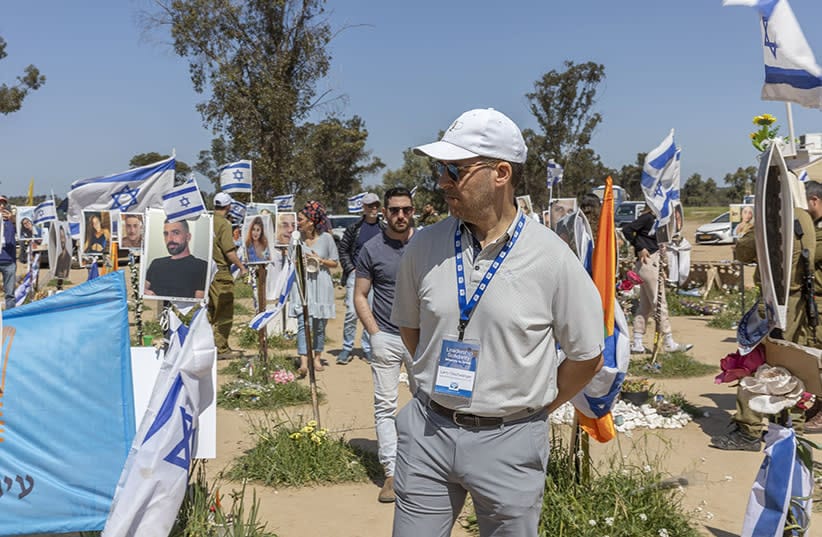 Larry Olschwanger at the memorial site of the Nova music festival on a solidarity delegation with Israel Bonds.  (credit: SHAHAR AZRAN)