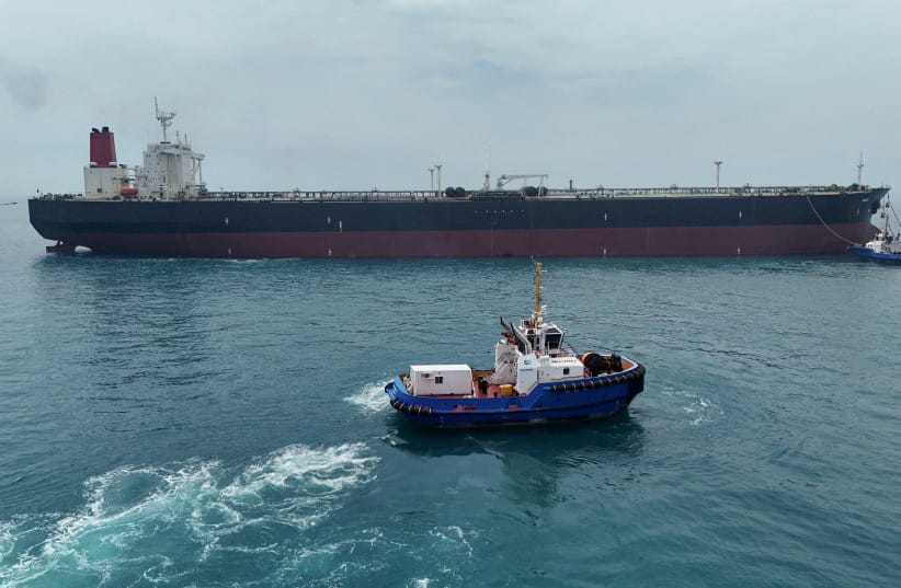 Drone view of oil tanker HELGA berthed at one of Iraq's southern offshore oil terminals near Basra as it prepares to load crude oil, becoming the second vessel to arrive since the closure of the Strait of Hormuz, April 24, 2026. (credit: REUTERS/Mohammed Aty/File Photo)