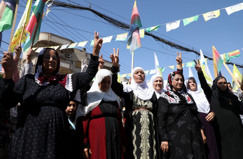 Women stand during a demonstration held under the slogan ''With our will, we will protect our revolution”, in Qamishli, Syria September 17, 2025. (credit: REUTERS/Orhan Qereman) Women stand during a demonstration held under the slogan ''With our will, we will protect our revolution”, in Qamishli, Syria September 17, 2025. (credit: REUTERS/Orhan Qereman)