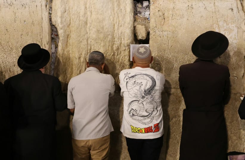 Jews praying at the Western Wall on Tisha B'Av, July 22, 2026. (credit: MARC ISRAEL SELLEM/THE JERUSALEM POST)