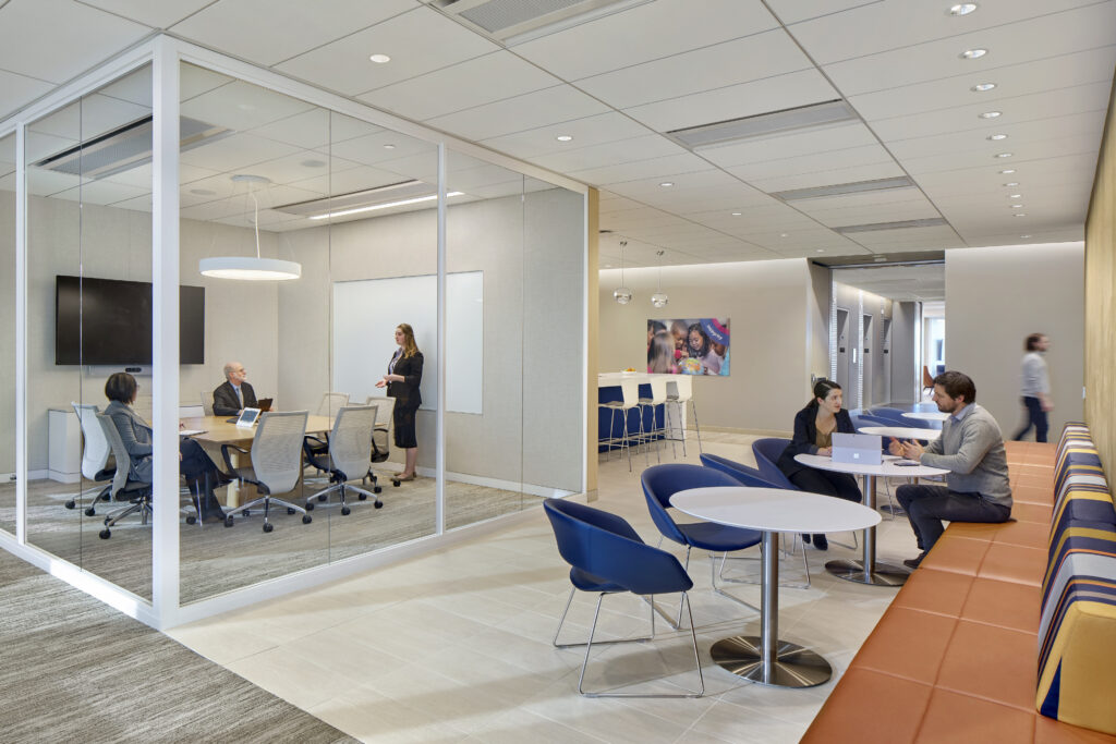 In a healthcare administration workplace, for example, shared amenities are deliberately positioned to support this dynamic: a central hub for meetings, both formal and informal, paired with a pantry along primary circulation paths, creates natural opportunities for connection throughout the day. 