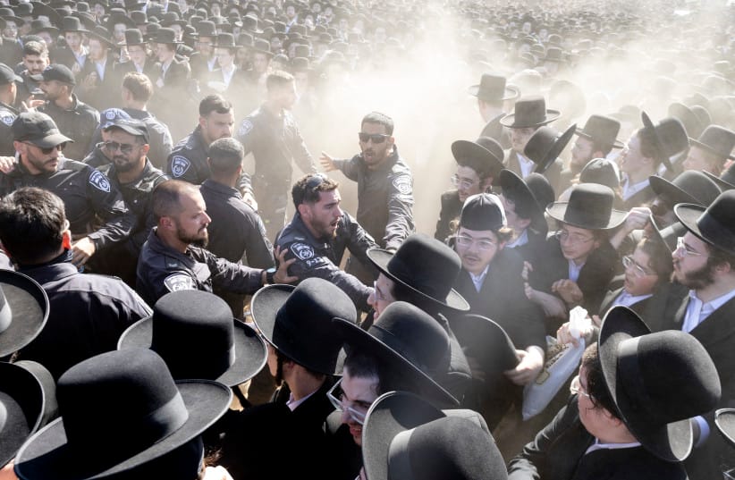Israeli police clash with haredi protesters during a mass demonstration against military conscription outside the Beit Lid military base in June. (credit: Amir Levy/Getty Images) Israeli police clash with haredi protesters during a mass demonstration against military conscription outside the Beit Lid military base in June. (credit: Amir Levy/Getty Images)