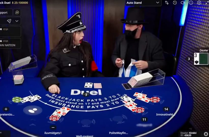 During a Duel.com blackjack table live stream, Levonyan, left, wears a full Nazi uniform and is confronted by a man dressed as a stereotypical Orthodox Jew who is holding an Israeli flag. (credit: screenshot)