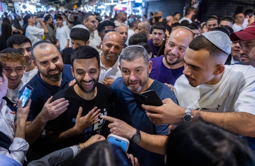 People of Israel party chairman Ofer Winter and party member Yoseph Haddad tour the Mahane Yehuda Market in Jerusalem ahead of the upcoming general elections, September 17, 2026.  (credit: CHAIM GOLDBERG/FLASH90)