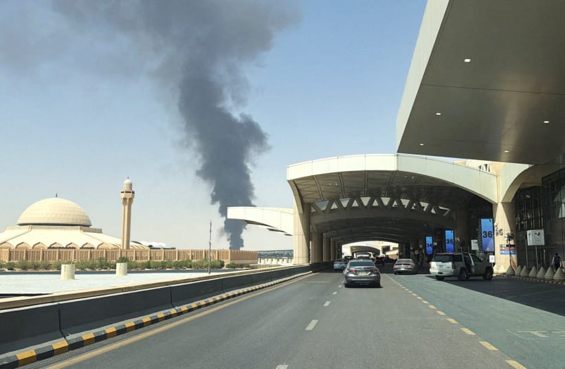 Large plume of black smoke rises from the fuel storage area at King Khalid International Airport, in Riyadh, Saudi Arabia, September 19, 2026. (credit: STRINGER/ REUTERS)