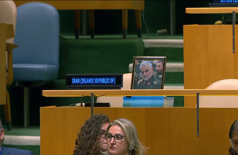 Iran's delegation left a photograph of arch-terrorist Islamic Revolutionary Guard Corps Quds Force leader Qasem Soleimani on the bench. (credit: screenshot) Iran's delegation left a photograph of arch-terrorist Islamic Revolutionary Guard Corps Quds Force leader Qasem Soleimani on the bench. (credit: screenshot)