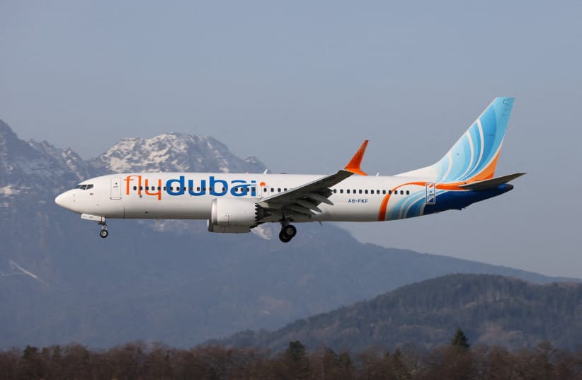 A Flydubai Boeing 737-8 MAX A6-FKF aircraft, which was bound for Israel from the United Arab Emirates diverted to Saudi Arabia, is seen flying over Salzburg, Austria, March 8, 2026 (credit: KARL DITTLBACHER/HANDOUT VIA REUTERS)