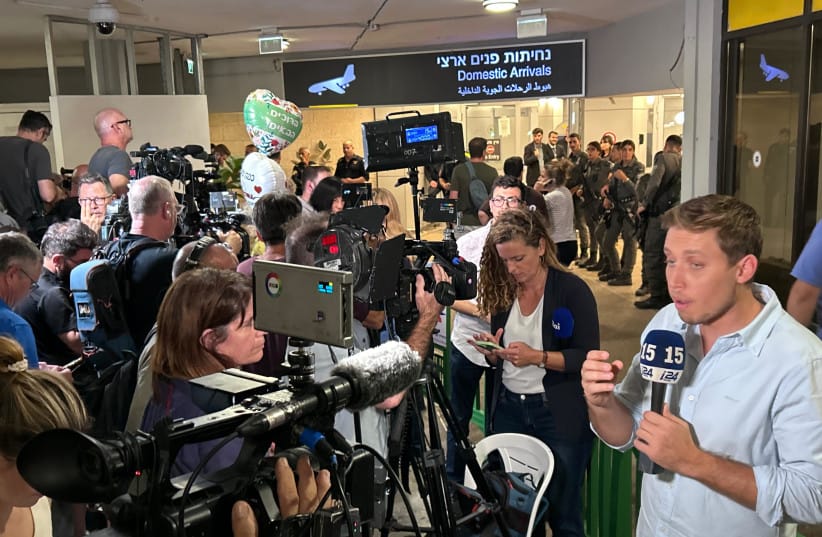 Media and loved ones await the passengers from the flydubai rescue flight for hijacked flight FZ1073 following its arrival in Israel on September 30, 2026. (credit: AVSHALOM SASSONI/MAARIV)