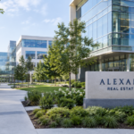 Alexandria Real Estate Equities sign beside a landscaped laboratory campus