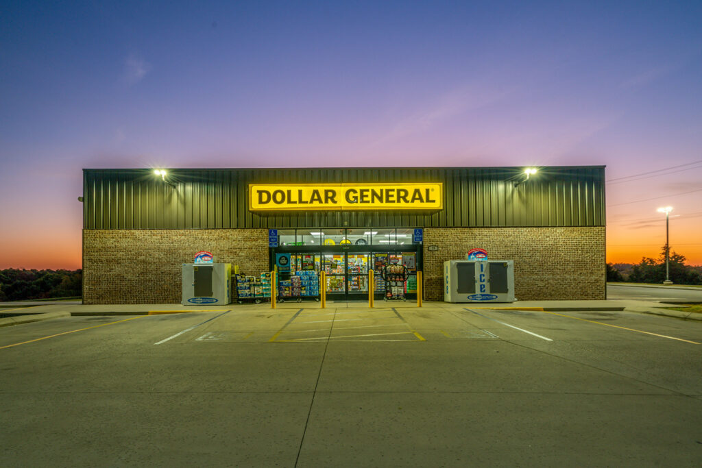 Dollar General store exterior and yellow sign at dusk