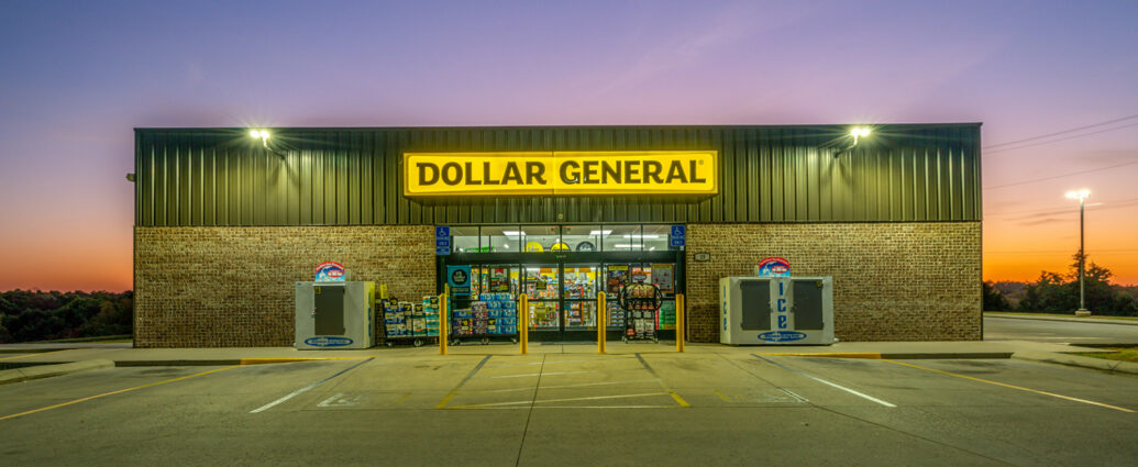 Dollar General store exterior and yellow sign at dusk