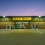 Dollar General store exterior and yellow sign at dusk