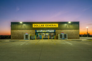 Dollar General store exterior and yellow sign at dusk