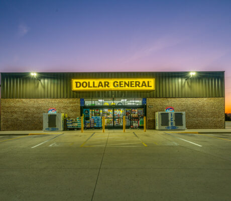 Dollar General store exterior and yellow sign at dusk