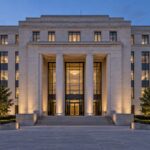 Stone office building exterior at dusk