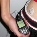 Archive photograph of an insulin pump and infusion set, not a device used in the Hybrid CATT1 study.