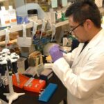NIH laboratory scientist at work in a file photograph, not an Artiva trial image
