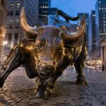 The Charging Bull statue near Wall Street at dawn