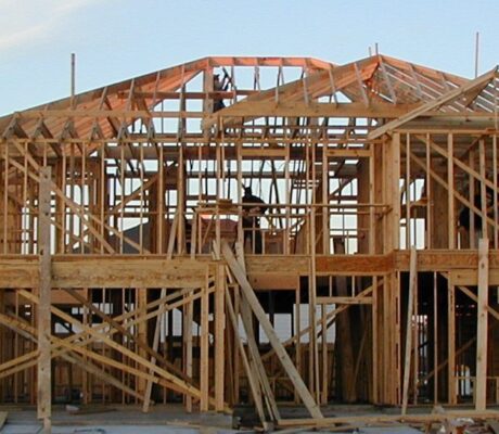 A wood-framed house under construction in Katy, Texas, in an archival photograph.