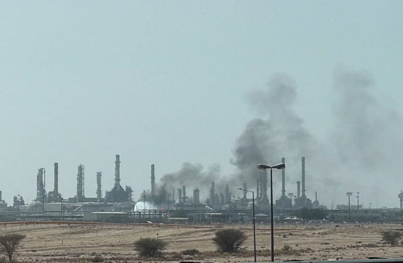 Smoke rises from a fire at the Aramco refinery south of Riyadh, Saudi Arabia, October 3, 2026. Picture taken with a mobile phone. (credit: REUTERS/STRINGER)