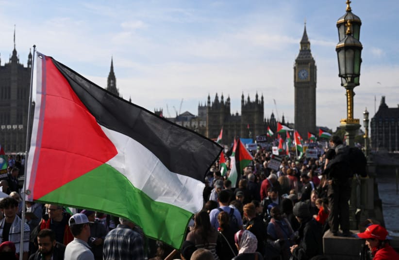 Demonstrators from the ''Palestine Coalition'' gather in support for Palestinians, after a ceasefire between Israel and Hamas in Gaza went into effect, in London, Britain, October 11, 2025; illustrative. (credit: REUTERS/JAIMI JOY)