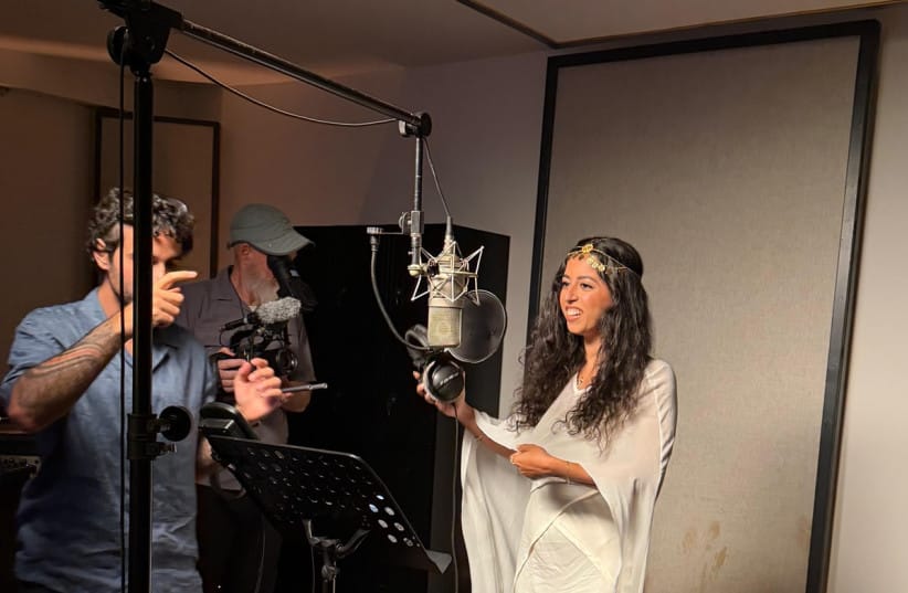 A singer records parts of “The Whole World Sings Together,” a multilingual project bringing together artists from different countries and backgrounds. (credit: Courtesy / Friends of Zion)
