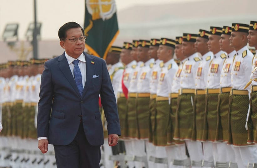 Myanmar's President Min Aung Hlaing reviews honour guards during a welcome ceremony at the prime minister's office in Putrajaya on October 8, 2026. (credit: Azneal Ishak / POOL / AFP via Getty Images)