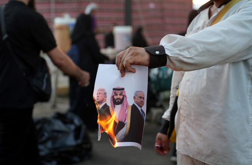 A man burns an image of US President Donald Trump, Saudi crown prince Mohammed bin Salman, Prime Minister Benjamin Netanyahu during a mourning ceremony at the Holy Shrine Of Imam Hossain in Karbala, Iraq, August 1, 2026 (credit: Meghdad Madadi ATPImages/Getty Images) A man burns an image of US President Donald Trump, Saudi crown prince Mohammed bin Salman, Prime Minister Benjamin Netanyahu during a mourning ceremony at the Holy Shrine Of Imam Hossain in Karbala, Iraq, August 1, 2026 (credit: Meghdad Madadi ATPImages/Getty Images)