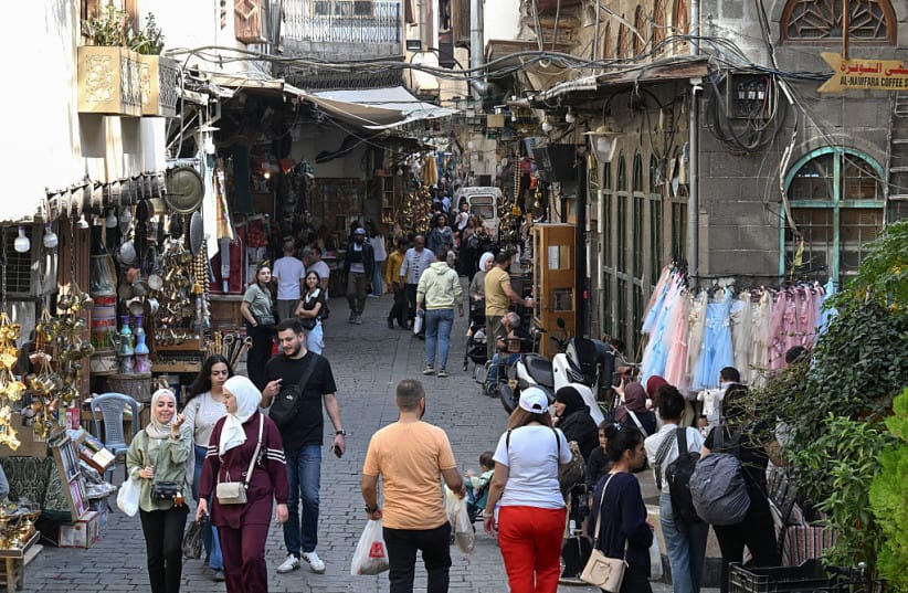 Syrians walk past shops down an alley at the Old City in Damascus on October 21, 2026. (credit: LOUAI BESHARA / AFP via Getty Images) Syrians walk past shops down an alley at the Old City in Damascus on October 21, 2026. (credit: LOUAI BESHARA / AFP via Getty Images)