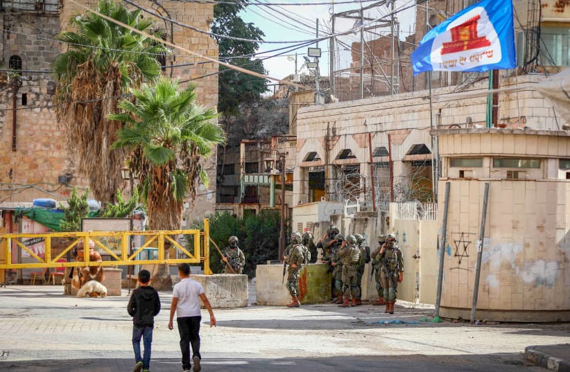 IDF soldiers take part in a military operation in the West Bank city of Hebron, October 29, 2026 (credit: WISAM HASHLAMOUN/FLASH90)