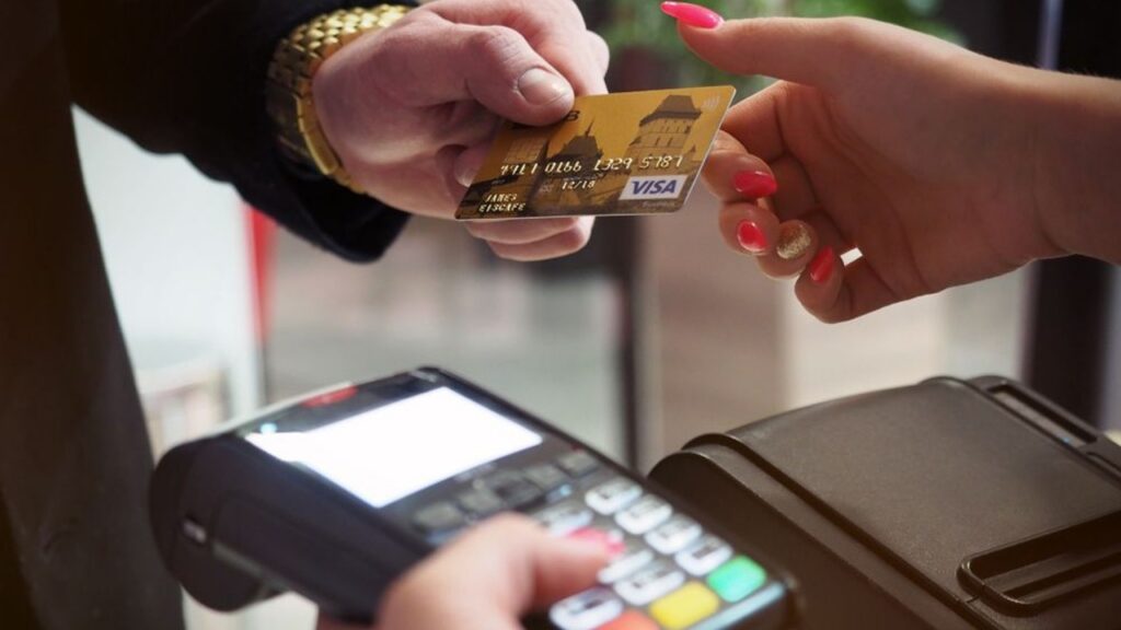 Archive photo of a card payment at a retail terminal, not identified as Adyen equipment