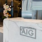 AIG headquarters lobby in New York, with AIG branding on the reception desk.