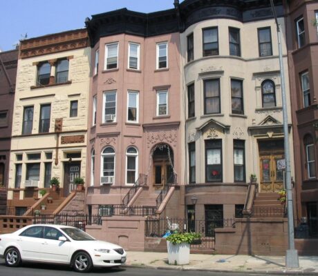 Archive photograph of Bedford-Stuyvesant brownstones in Brooklyn, illustrating a guide to NYC building records.