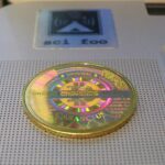 A gold-colored Casascius physical bitcoin coin.