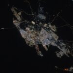 Archive NASA photograph of Dammam, Saudi Arabia, from the International Space Station, May 22, 2025; not the October 2026 missile incident.